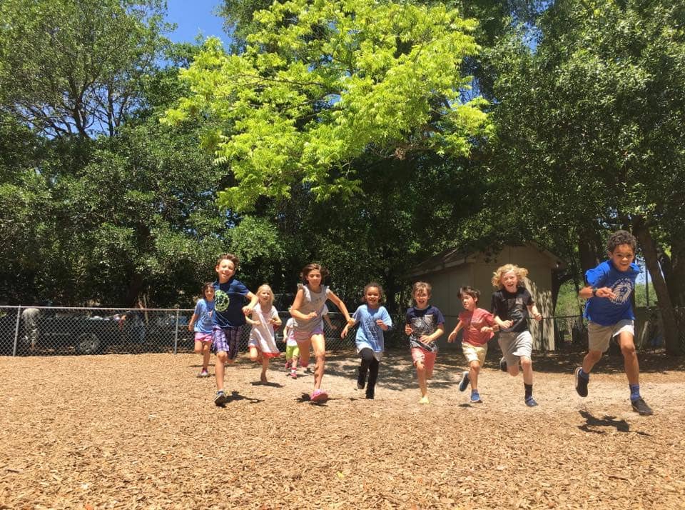 Children playing outdoors at Sundrops Montessori